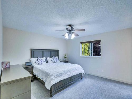 256 Cove Drive, Chestermere, AB - Indoor Photo Showing Bedroom