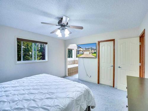 256 Cove Drive, Chestermere, AB - Indoor Photo Showing Bedroom