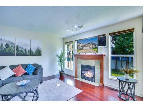 256 Cove Drive, Chestermere, AB - Indoor Photo Showing Living Room With Fireplace