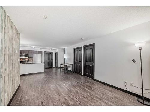 2111-403 Mackenzie Way Sw, Airdrie, AB - Indoor Photo Showing Other Room