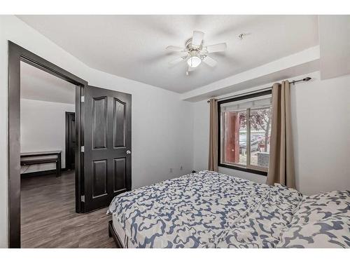 2111-403 Mackenzie Way Sw, Airdrie, AB - Indoor Photo Showing Bedroom