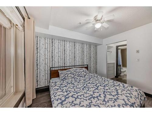 2111-403 Mackenzie Way Sw, Airdrie, AB - Indoor Photo Showing Bedroom