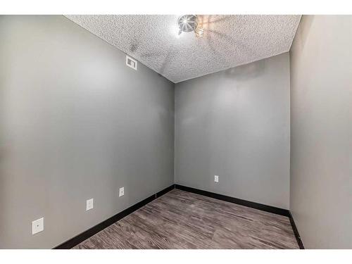 2111-403 Mackenzie Way Sw, Airdrie, AB - Indoor Photo Showing Other Room