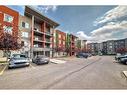 2111-403 Mackenzie Way Sw, Airdrie, AB  - Outdoor With Facade 