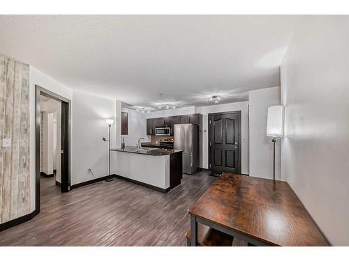 2111-403 Mackenzie Way Sw, Airdrie, AB - Indoor Photo Showing Kitchen