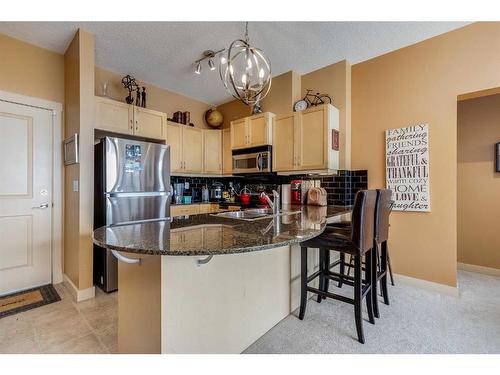 6305-11811 Lake Fraser Drive Se, Calgary, AB - Indoor Photo Showing Kitchen With Double Sink