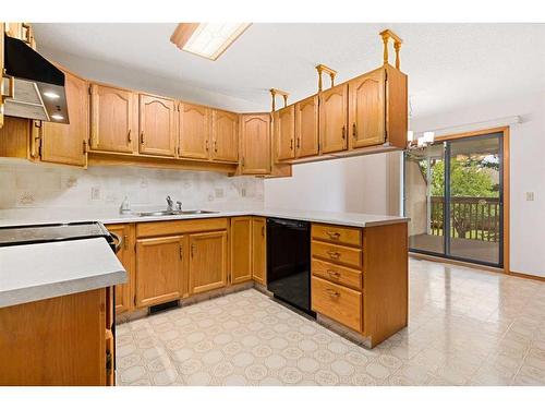 61 Sandarac Circle Nw, Calgary, AB - Indoor Photo Showing Kitchen With Double Sink