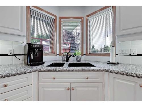 170 Woodpark Circle Sw, Calgary, AB - Indoor Photo Showing Kitchen With Double Sink