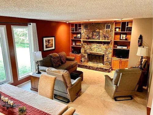 818 7 Avenue Ne, Three Hills, AB - Indoor Photo Showing Living Room With Fireplace