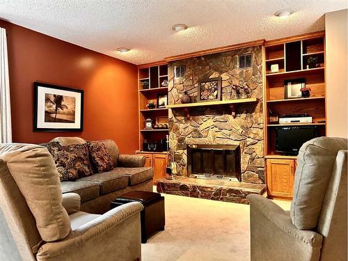 818 7 Avenue Ne, Three Hills, AB - Indoor Photo Showing Living Room With Fireplace