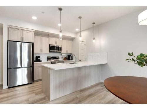 2209-220 Seton Grove Se, Calgary, AB - Indoor Photo Showing Kitchen With Upgraded Kitchen