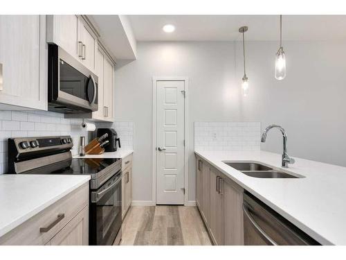 2209-220 Seton Grove Se, Calgary, AB - Indoor Photo Showing Kitchen With Double Sink With Upgraded Kitchen