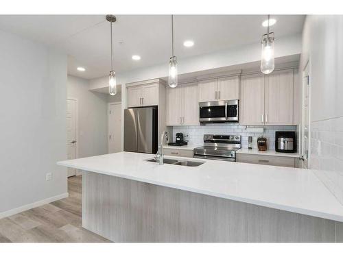 2209-220 Seton Grove Se, Calgary, AB - Indoor Photo Showing Kitchen With Double Sink With Upgraded Kitchen