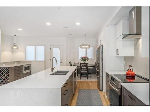 1904 12 Street Sw, Calgary, AB - Indoor Photo Showing Kitchen With Stainless Steel Kitchen With Double Sink With Upgraded Kitchen