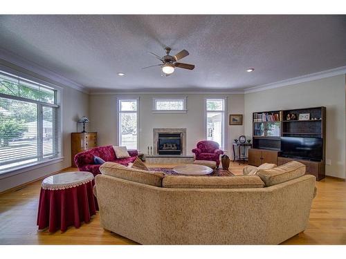 224 52 Avenue West, Claresholm, AB - Indoor Photo Showing Living Room With Fireplace