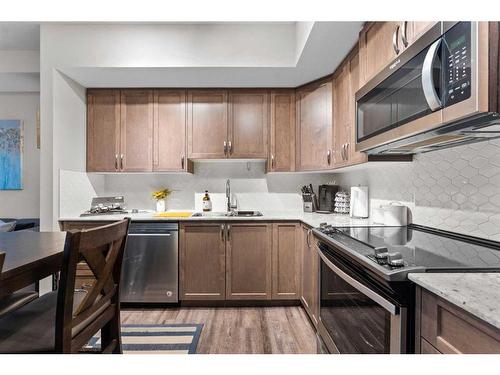 2115-3727 Sage Hill Drive Nw, Calgary, AB - Indoor Photo Showing Kitchen With Stainless Steel Kitchen