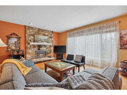 11326 87 Street Se, Calgary, AB - Indoor Photo Showing Living Room With Fireplace