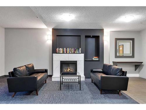 4307-73 Erin Woods Court Se, Calgary, AB - Indoor With Fireplace