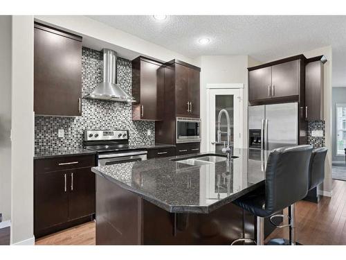 187 Cranford Crescent Se, Calgary, AB - Indoor Photo Showing Kitchen With Stainless Steel Kitchen With Double Sink With Upgraded Kitchen