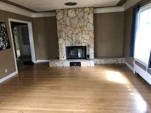 2034 52 Avenue Sw, Calgary, AB - Indoor Photo Showing Living Room With Fireplace