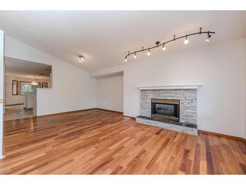 64 Chaparral Way Se, Calgary, AB - Indoor Photo Showing Living Room With Fireplace