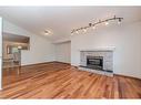 64 Chaparral Way Se, Calgary, AB  - Indoor Photo Showing Living Room With Fireplace 