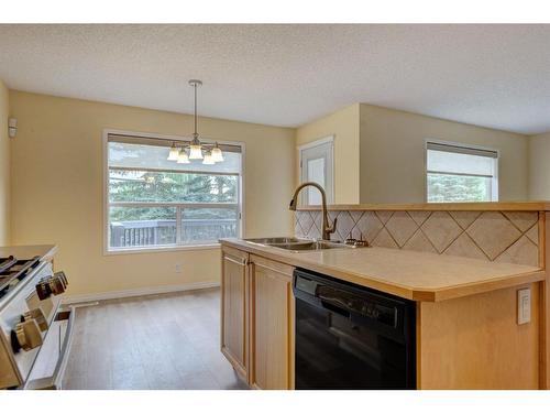 244 Cranfield Park Se, Calgary, AB - Indoor Photo Showing Kitchen With Double Sink