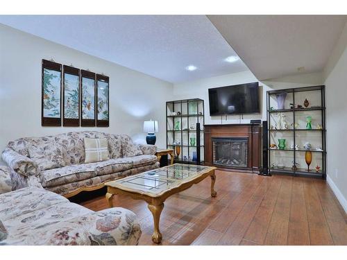 31 Sherwood Heath Nw, Calgary, AB - Indoor Photo Showing Living Room With Fireplace