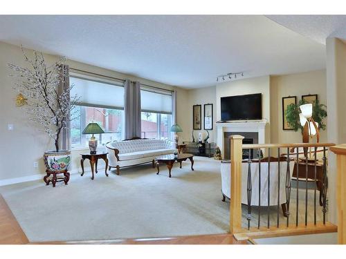 31 Sherwood Heath Nw, Calgary, AB - Indoor Photo Showing Living Room With Fireplace