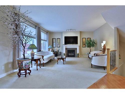 31 Sherwood Heath Nw, Calgary, AB - Indoor Photo Showing Other Room With Fireplace