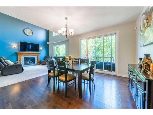 94 Aspen Hills Way Sw, Calgary, AB - Indoor Photo Showing Other Room With Fireplace