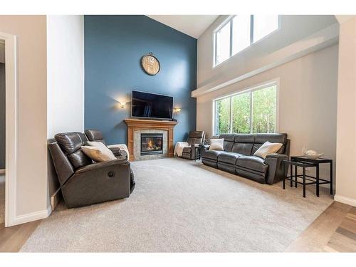 94 Aspen Hills Way Sw, Calgary, AB - Indoor Photo Showing Living Room With Fireplace