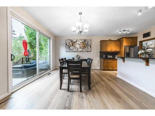 94 Aspen Hills Way Sw, Calgary, AB - Indoor Photo Showing Living Room With Fireplace