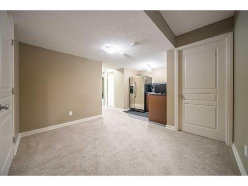 94 Aspen Hills Way Sw, Calgary, AB - Indoor Photo Showing Other Room