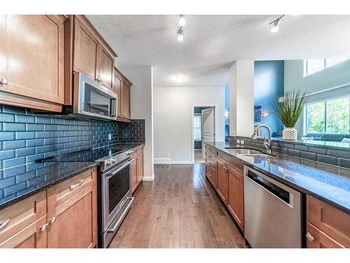 94 Aspen Hills Way Sw, Calgary, AB - Indoor Photo Showing Kitchen With Upgraded Kitchen