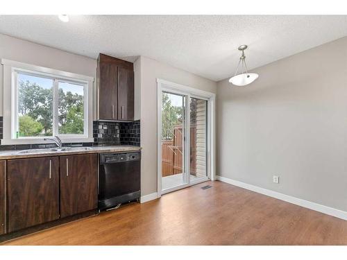 2306-2445 Kingsland Road, Airdrie, AB - Indoor Photo Showing Kitchen With Double Sink