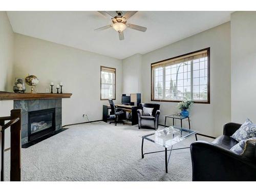 140 Cranwell Crescent Se, Calgary, AB - Indoor Photo Showing Living Room With Fireplace