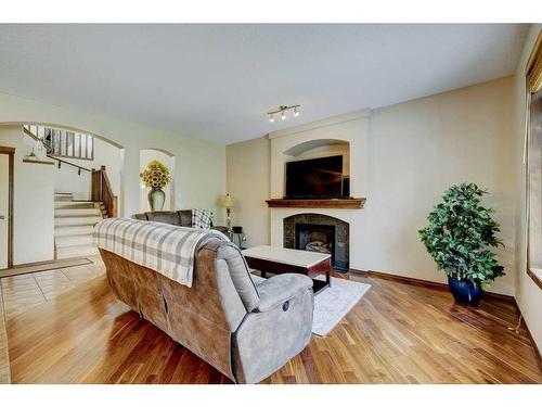 140 Cranwell Crescent Se, Calgary, AB - Indoor Photo Showing Living Room With Fireplace