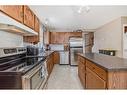 53 Millrise Mews Sw, Calgary, AB  - Indoor Photo Showing Kitchen With Double Sink 