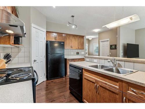 95 Kincora Glen Green Nw, Calgary, AB - Indoor Photo Showing Kitchen With Double Sink