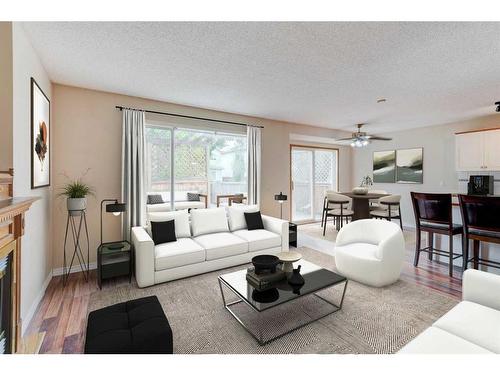 115 Mt Apex Crescent Se, Calgary, AB - Indoor Photo Showing Living Room With Fireplace