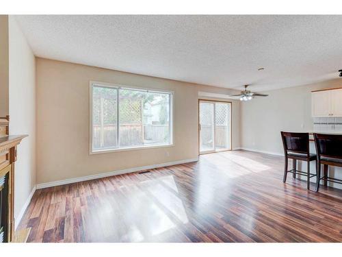 115 Mt Apex Crescent Se, Calgary, AB - Indoor Photo Showing Living Room With Fireplace