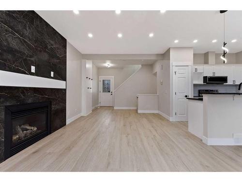 250 Cougar Plateau Mews Sw, Calgary, AB - Indoor With Fireplace