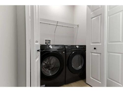 250 Cougar Plateau Mews Sw, Calgary, AB - Indoor Photo Showing Laundry Room