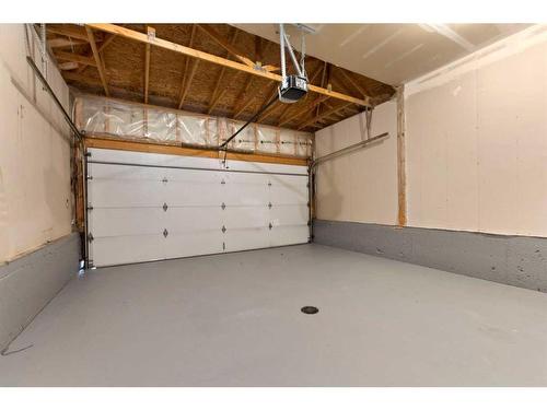 250 Cougar Plateau Mews Sw, Calgary, AB - Indoor Photo Showing Garage