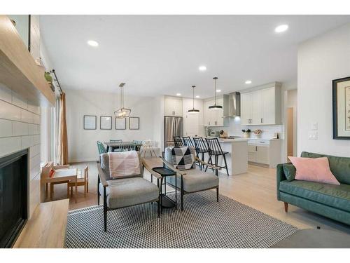 55 Shawnee Heath Sw, Calgary, AB - Indoor Photo Showing Living Room With Fireplace