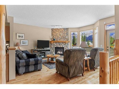 1077 Wilson Way, Canmore, AB - Indoor Photo Showing Living Room With Fireplace