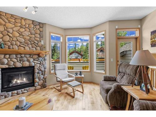 1077 Wilson Way, Canmore, AB - Indoor Photo Showing Living Room With Fireplace