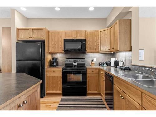 1077 Wilson Way, Canmore, AB - Indoor Photo Showing Kitchen With Double Sink