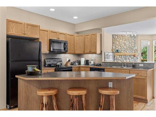 1077 Wilson Way, Canmore, AB - Indoor Photo Showing Kitchen With Double Sink